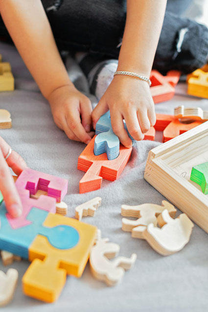 Child playing with puzzle